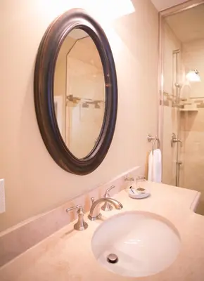 a bathroom with a sink and a mirror at 124 on Queen Hotel & Spa in Niagara on the Lake