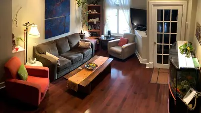 a living room with a couch and a coffee table at A Seaton Dream in Toronto