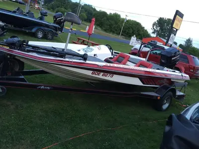 a boat on a trailer on the grass at Budget Inn in Port Hope