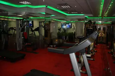 a gym with a treadmill and exercise equipment at Yonge Suites Apart Hotel in Toronto