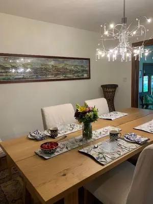 a wooden table with chairs and a dining room at Cedar Gables Bed & Breakfast in Niagara on the Lake