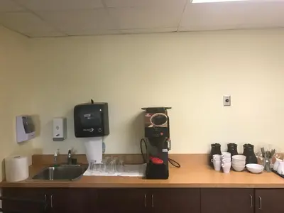 a kitchen counter with a sink and a mixer at Super 8 by Wyndham Barrie South in Barrie