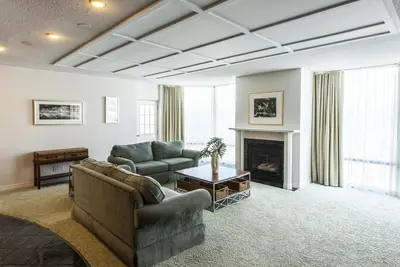 a living room with two couches and a fireplace at Georgian Bay Hotel Trademark Collection by Wyndham in Collingwood
