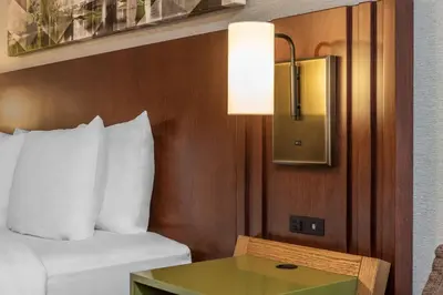 a hotel room with a bed and a table at Comfort Inn in Cambridge