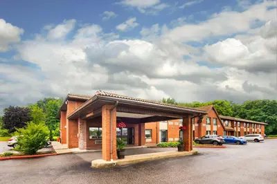 a hotel with a parking lot in front of it at Comfort Inn in Midland