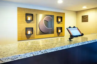 a laptop sitting on a counter in a hotel room at Comfort Inn in Midland