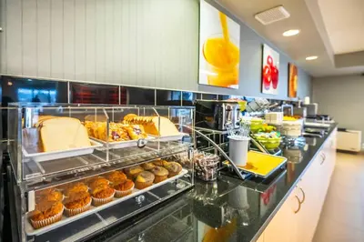 a buffet line with pastries and muffins on display at Quality Inn in Barrie