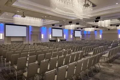 an empty lecture hall with chairs and screens at Courtyard by Marriott Oshawa in Oshawa