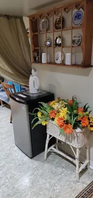 a table with a basket of flowers on it at Private Apartment Close to Airport Toronto Pearson in Toronto