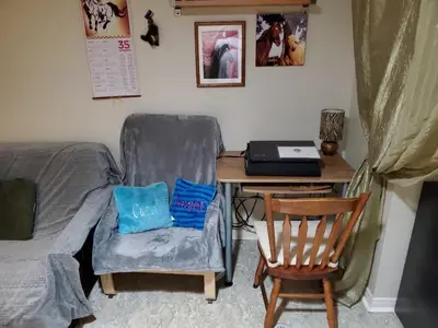 a bedroom with a desk with a chair and a laptop at Private Apartment Close to Airport Toronto Pearson in Toronto