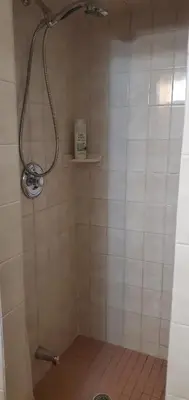 a shower with a shower head in a bathroom at Private Apartment Close to Airport Toronto Pearson in Toronto
