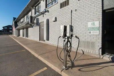 a pay phone sitting on the side of a building at Comfort Inn in Hamilton