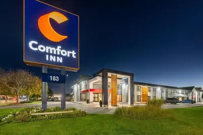 a sign for a comfort inn in front of a building at Comfort Inn in Hamilton