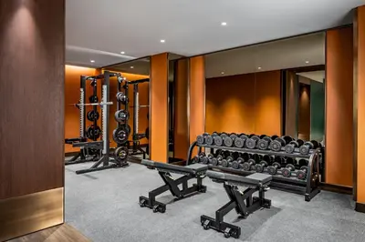 a gym with several rows of dumbbells and a row ofngth at Fairmont Royal York Gold Experience in Toronto