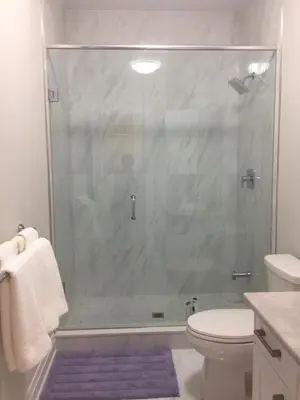 a bathroom with a glass shower with a toilet at Charming, Comfortable Bsmt Apartment in Pickering in Pickering