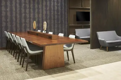 a wooden table with white chairs and a wooden box at Hyatt Place Toronto Mississauga and Luxe Convention Centre in Mississauga