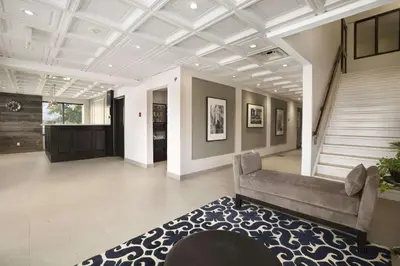 a living room with a couch and a rug at Days Inn by Wyndham Stouffville in Stouffville