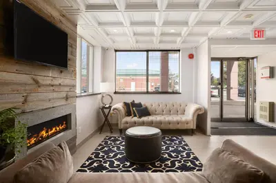 a living room with a couch and a fireplace at Days Inn by Wyndham Stouffville in Stouffville