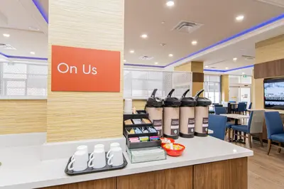 an on us counter in an office with chairs at TownePlace Suites by Marriott Brantford and Conference Centre in Brantford