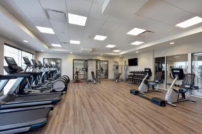 a gym with treadmills and elliptical machines at Staybridge Suites - Waterloo - St. Jacobs Area in Waterloo
