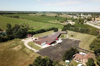 an aerial view of a church with a parking lot at King Hotel in Palmerston