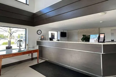 a restaurant with a counter with a counter top at Travelodge by Wyndham Welland in Welland