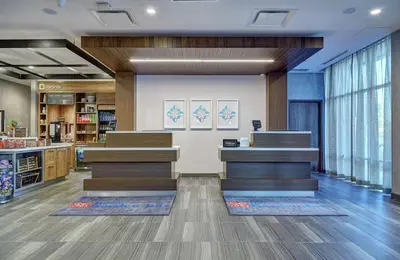 a lobby of a store with stairs and windows at Hilton Garden Inn Toronto/Brampton West, Ontario, Canada in Brampton