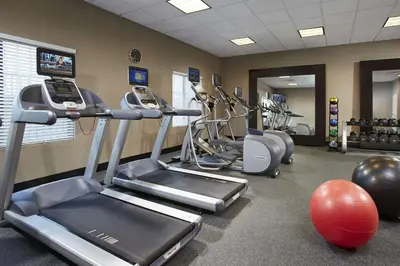 a gym with cardio equipment and exercise bikes at Hilton Garden Inn Toronto/Brampton West, Ontario, Canada in Brampton
