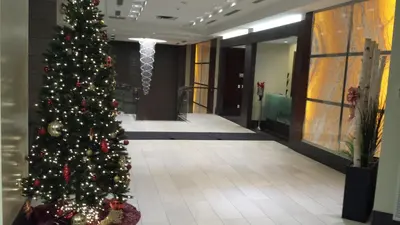 a christmas tree in the middle of a hallway at SPECTACULAR VIEW, 2 BEDROOMS FURNISHED CONDO and BEST LOCATION in Mississauga