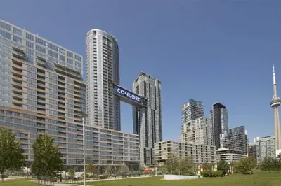 a city skyline with tall buildings and a street sign at Cozy Condo near CN Tower in Toronto
