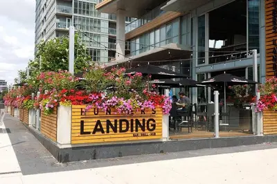 a sign for a landling restaurant with flowers on it at Cozy Condo near CN Tower in Toronto