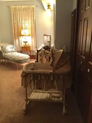 a room with a table and a bed in a room at Pemberley House Bed and Breakfast in Seaforth
