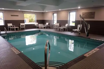 a large swimming pool in a hotel room at Country Inn & Suites by Radisson, Belleville, ON in Belleville