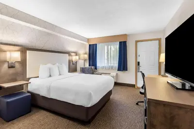 a hotel room with a bed and a desk at Best Western Halton Hills in Georgetown
