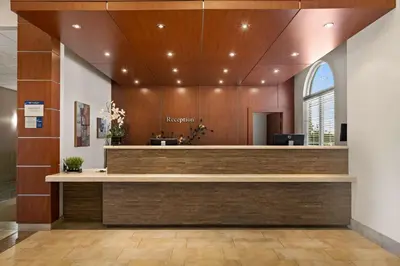 a lobby of a hospital with a reception desk at Best Western Plus Orangeville Inn & Suites in Orangeville