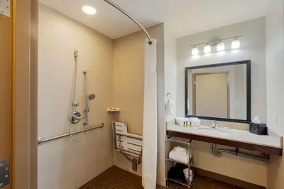 a bathroom with a sink and a shower at Best Western Plus Walkerton Hotel & Conference Centre in Walkerton