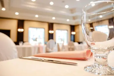 a wine glass sitting on top of a table at The Casablanca Hotel in Grimsby
