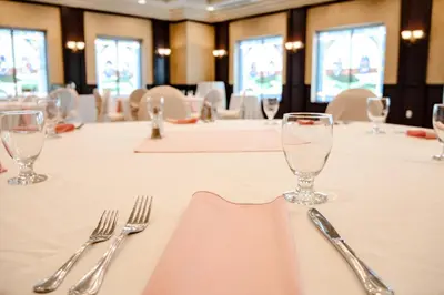 a table with silverware on a white table cloth at The Casablanca Hotel in Grimsby