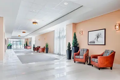 a lobby of a hospital with chairs and tables at Four Points by Sheraton London in London