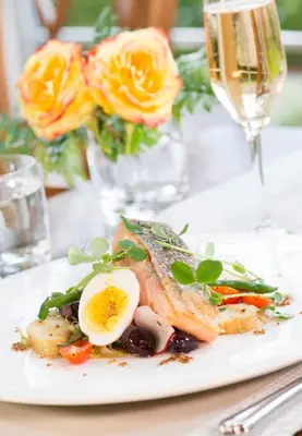 a plate of food with an egg on a table at Inn On The Twenty in Jordan