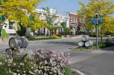 a street with two barrels on the side of the road at Jordan House Hotel in Jordan