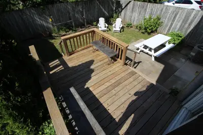 an overhead view of a wooden deck with a bench at Maison Doucet in Niagara Falls