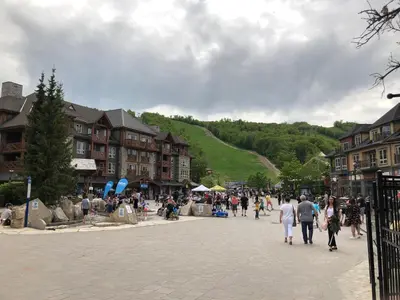 a group of people walking down a street in a town at Blue Mountain (1 bedroom) Escape at North Creek Resort in Blue Mountains