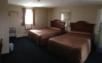a hotel room with two beds and a window at Majers Motel in Stratford