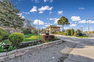 a street with a house in the background at Park Motel in Toronto