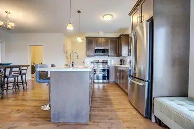 a kitchen with a stainless steel refrigerator freezer at GlobalStay Modern House near Huron Lake Port Elgin in Port Elgin