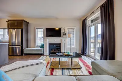 a living room with a couch and a fireplace at GlobalStay Modern House near Huron Lake Port Elgin in Port Elgin
