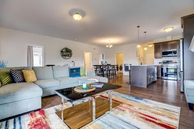 a living room with a couch and a table at GlobalStay Modern House near Huron Lake Port Elgin in Port Elgin