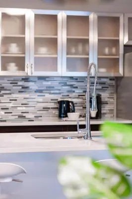 a kitchen with a sink and aaucet at ENTIRE 2 BEDROOM APARTMENT UPTOWN WATERLOO - e2 in Waterloo
