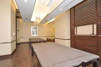 a hospital room with a bed and a window at Royal Stays Furnished Apartments - Square One in Mississauga